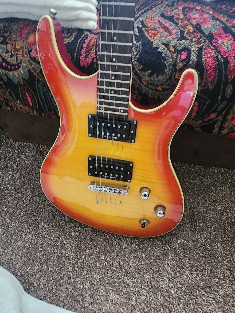 Washburn RX-40 solid-body electric guitar in a classic Flame Vintage Sunburst
